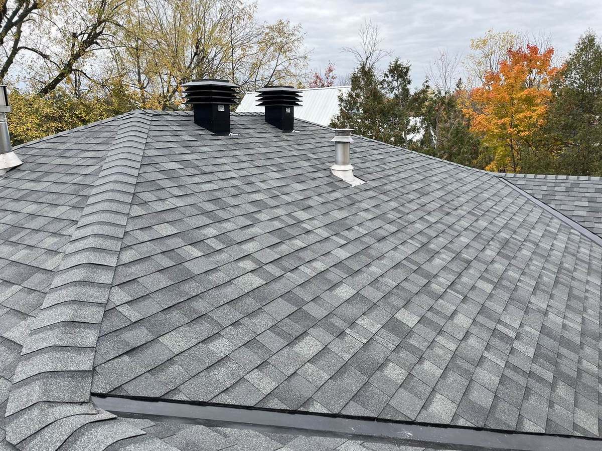 Estate Gray shingle roof showing neat valley and flashing workmanship