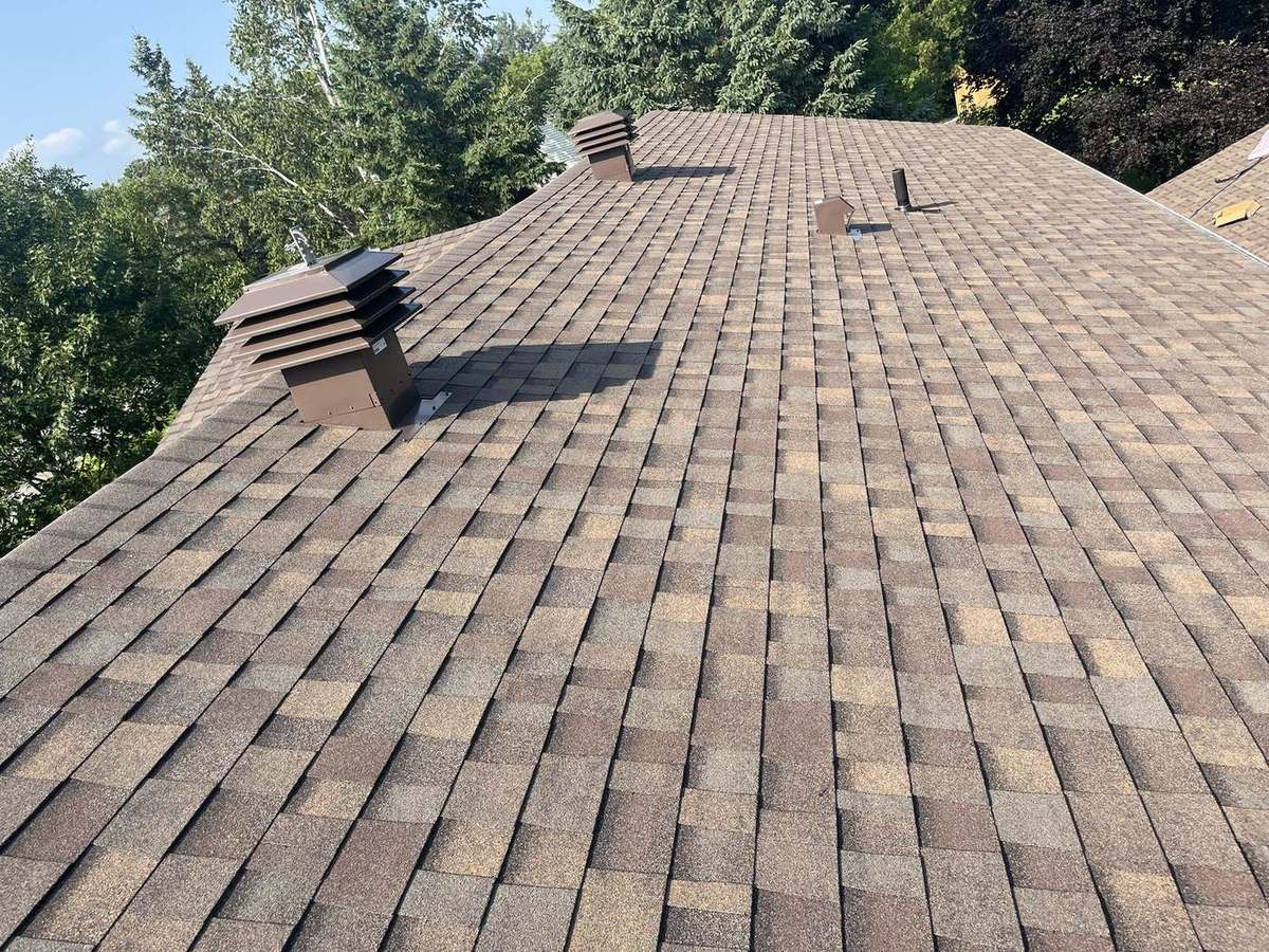Teak asphalt shingle roof installed by Rob's Quality Roofing in the Ottawa region — project 1