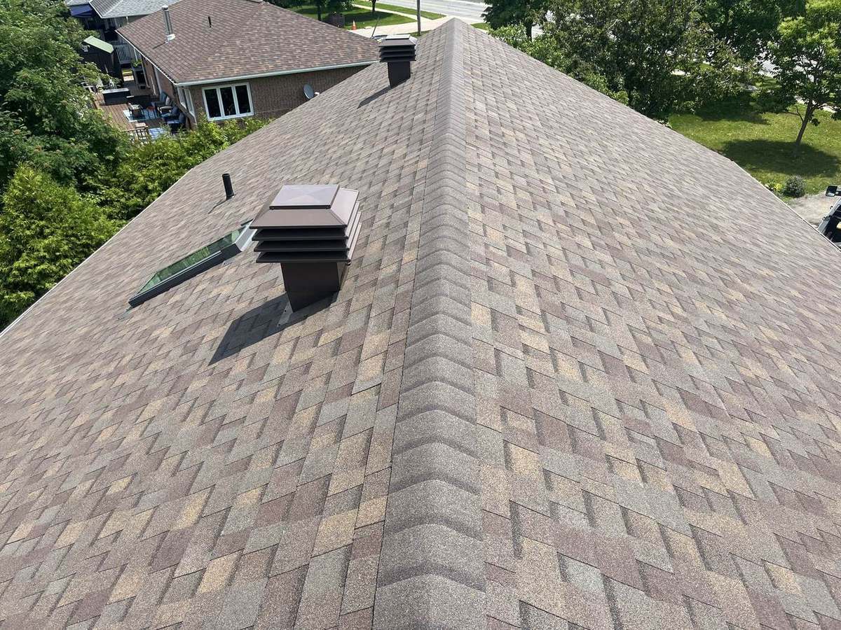 Teak shingle roof with new vents and tidy ridge line