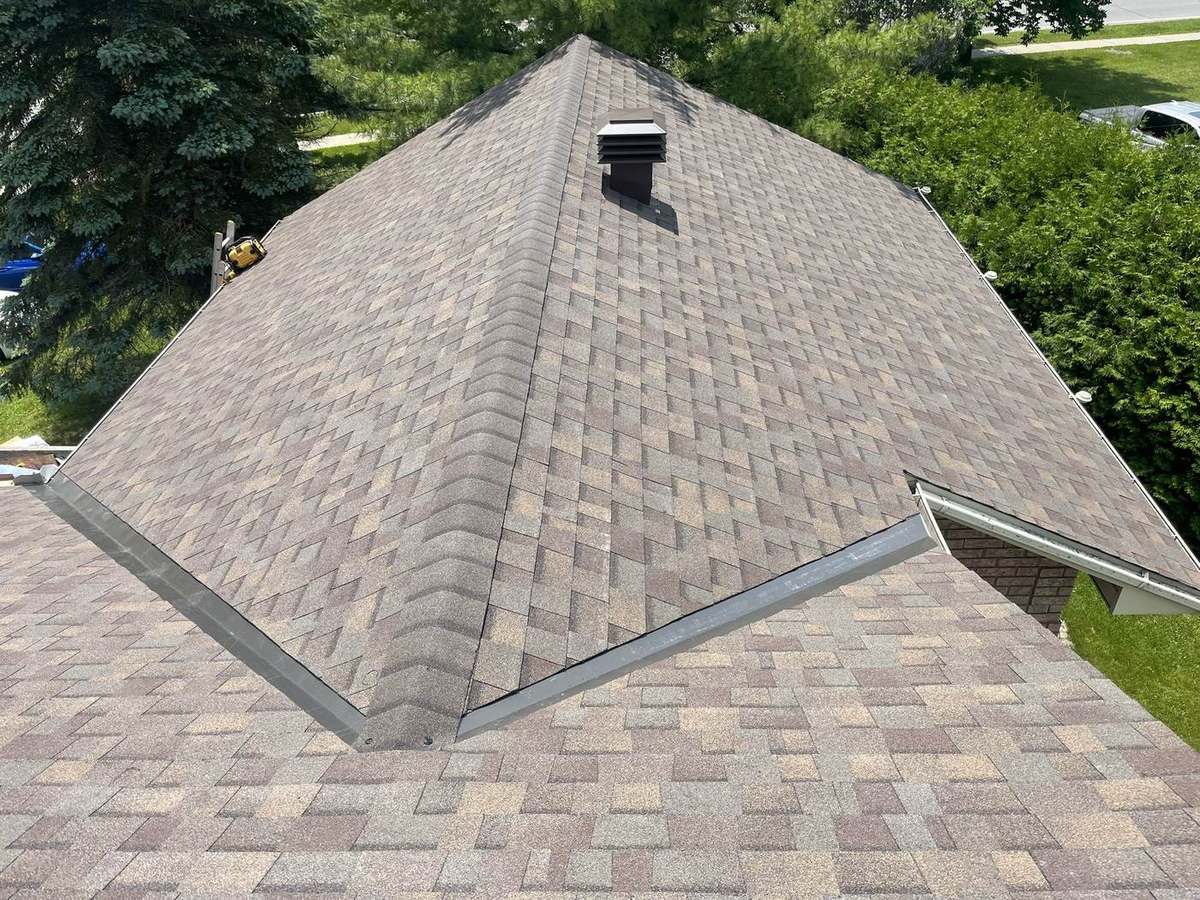 Teak asphalt shingle roof installed by Rob's Quality Roofing in the Ottawa region — project 5