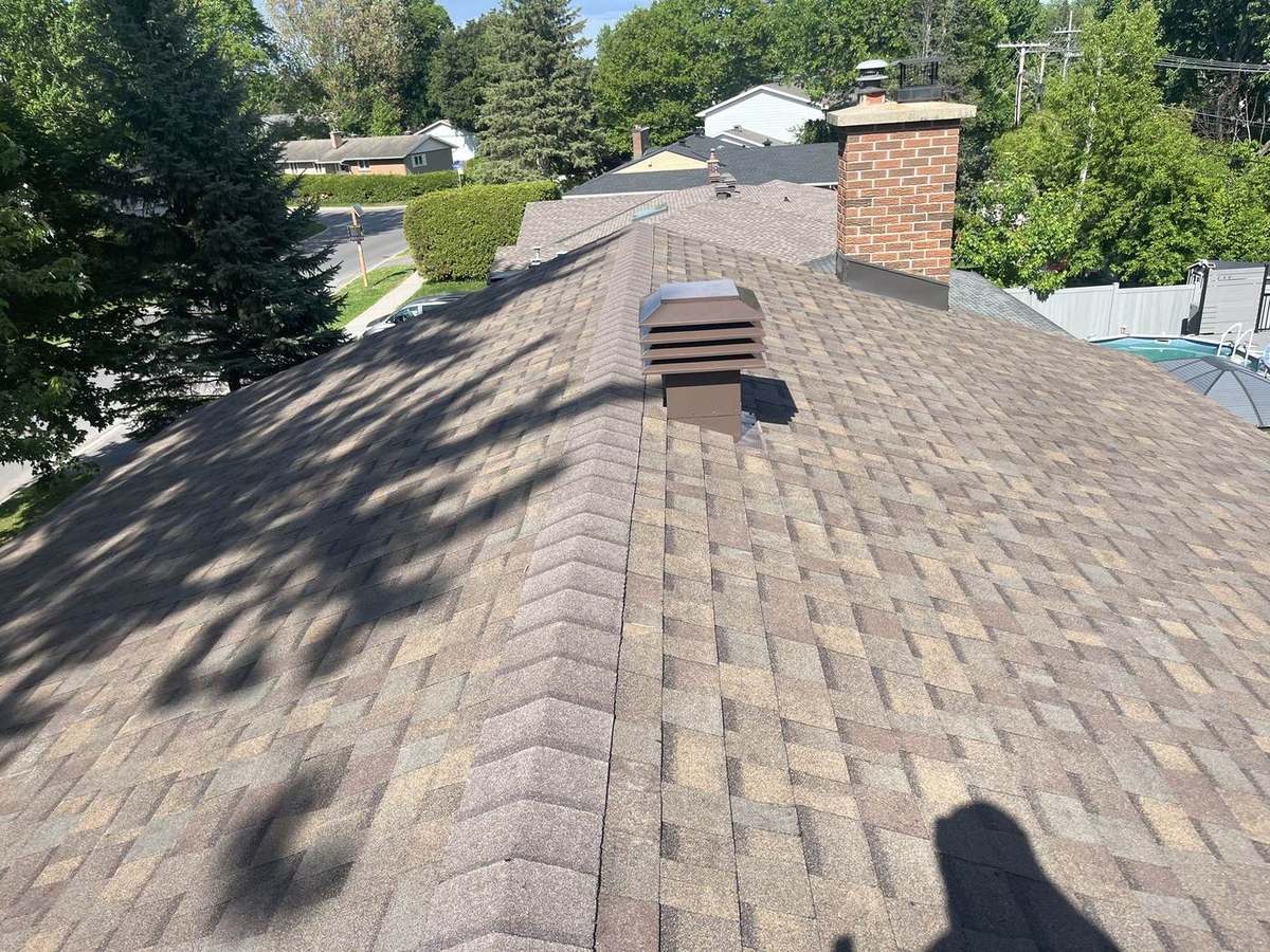 Teak asphalt shingle roof installed by Rob's Quality Roofing in the Ottawa region — project 6