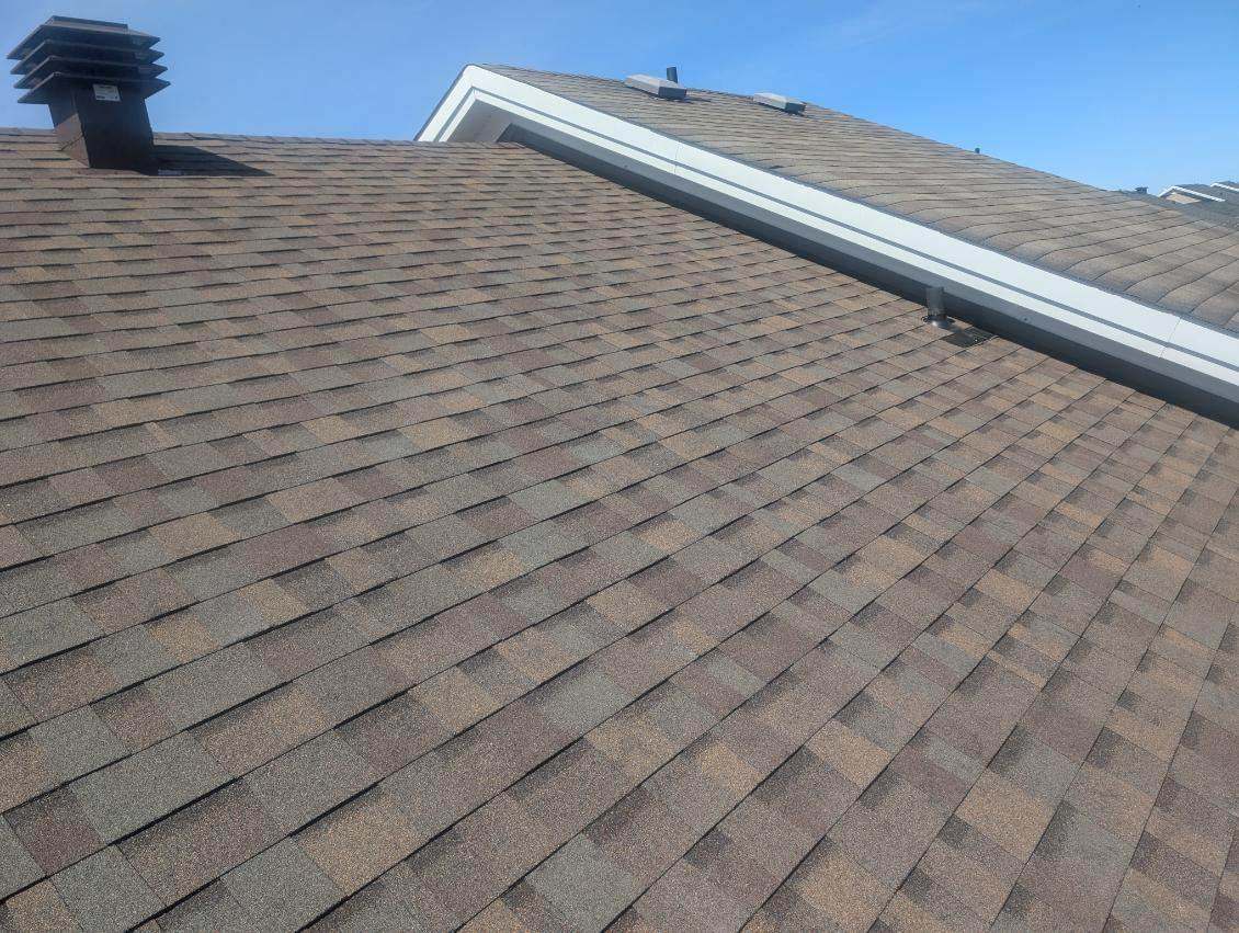 Teak asphalt shingle roof installed by Rob's Quality Roofing in the Ottawa region — project 8